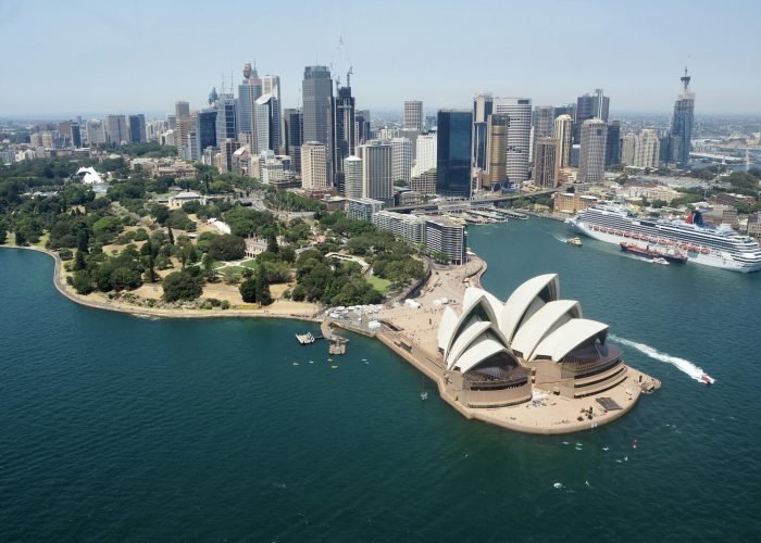 View of Sydney Opera house from the air and city skyline