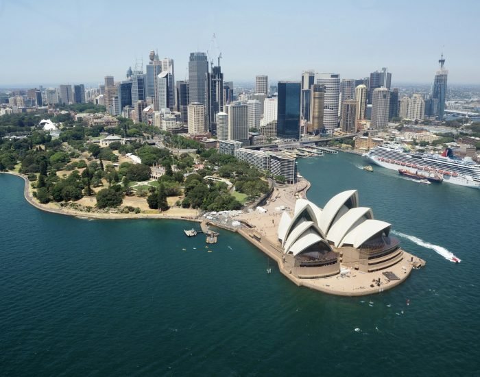 View of Sydney Opera house from the air and city skyline